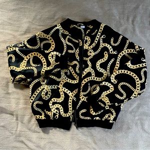 h&m black bomber jacket with gold chains printed all over